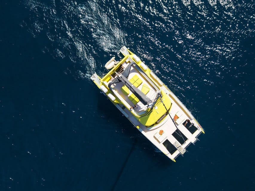 Barcelona: Daytime or Sunset Catamaran Cruise with Music - The Catamaran Experience: Wave-Bar Vibes and Photo-Friendly Corners