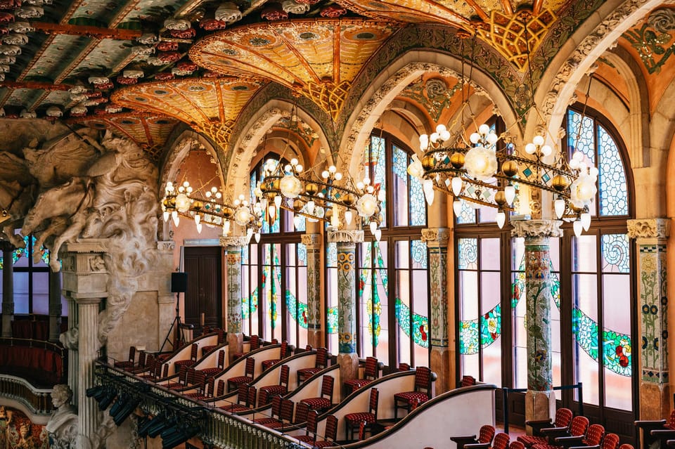 Barcelona: Palau de la Música Guided Tour - The grand staircase: flowers, flags, and materials you can actually spot