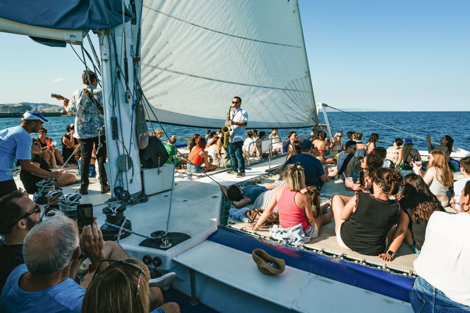 Barcelona: Sunset Catamaran Cruise with Live Music - The nets area (1 meter above water): how to enjoy the best onboard spots