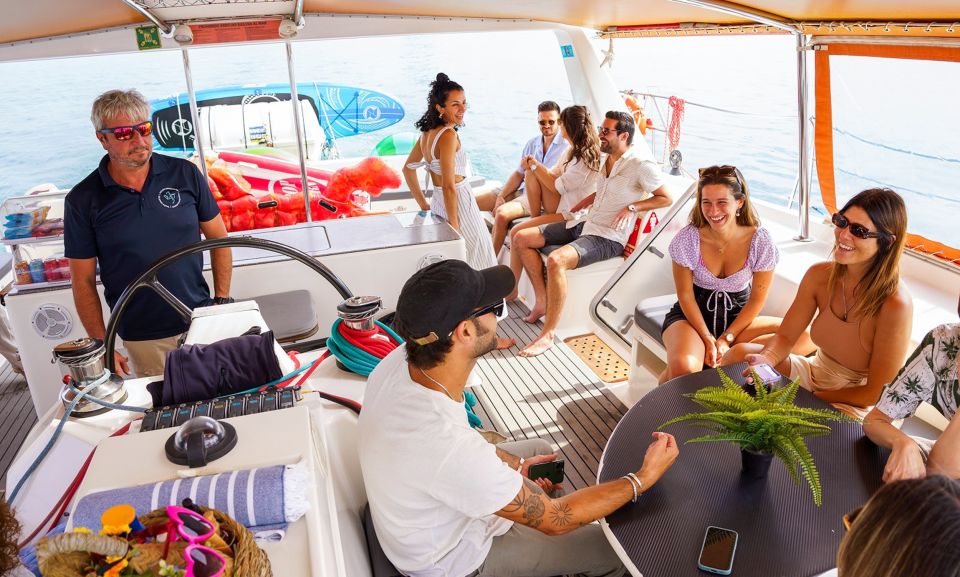 Barcelona: Sunset or Day Catamaran Cruise with Tapa & Drink - Crew vibe and onboard atmosphere: music, humor, and real supervision