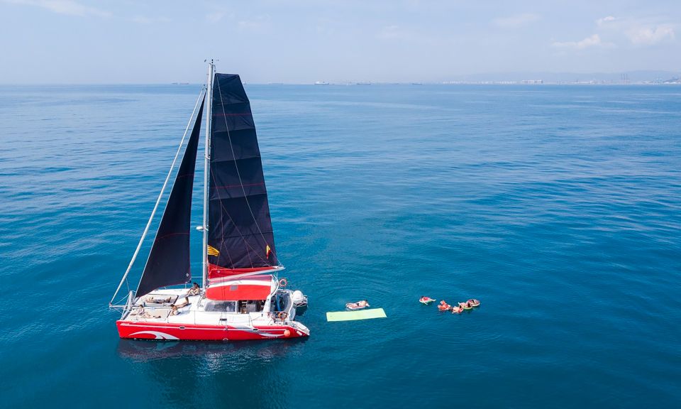 Barcelona: Sunset or Day Catamaran Cruise with Tapa & Drink - A catamaran built for lounging, not just sitting still