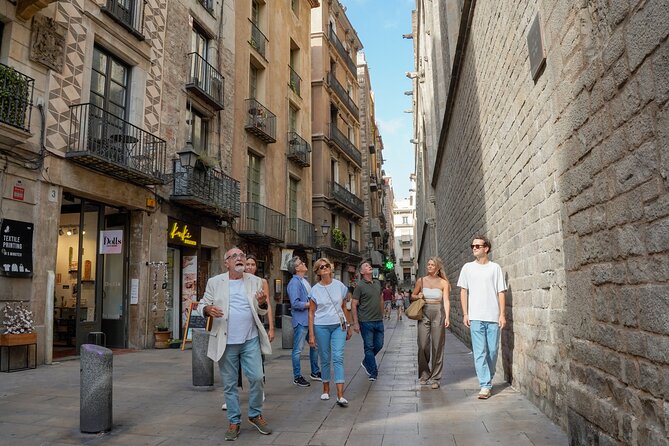 Barcelona Tapas and Wine Experience Small-Group Walking Tour - Walking From Plaça Sant Jaume Through the Gothic Quarter