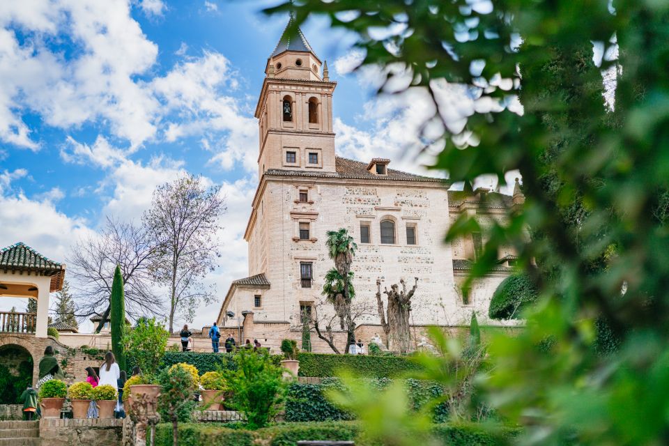 Granada: Alhambra Guided Tour with Nasrid Palaces & Gardens - Alcazaba fortress walk: Vermilion Towers and a clifftop view