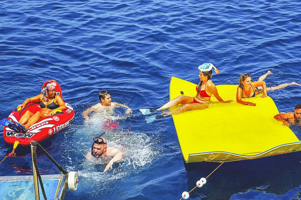 Ibiza: Beach Hopping Cruise w/ Paddleboard, Food, & Drinks - Onboard Comfort and Gear: Glass-Bottom Deck and Water Slides