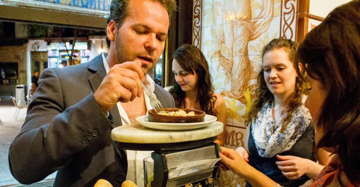Madrid: Tapas & Wine Tasting Tour with Local Guide - Las Letras Quarter: three tapas stops where the city smells like food