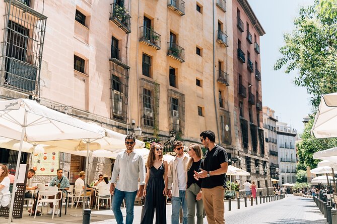 Madrid Tapas & Wine Tour with Rooftop Views and Local Guide - Plaza Mayor and the Ham-Wine Pairing That Sets the Tone