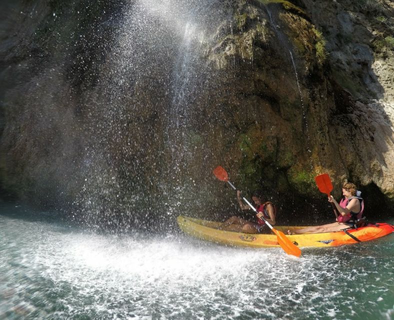 Nerja: Guided Kayak Tour Nerja Cliffs and Maro Waterfall - Cascada de Maro: the rain-shower moment and a short reset