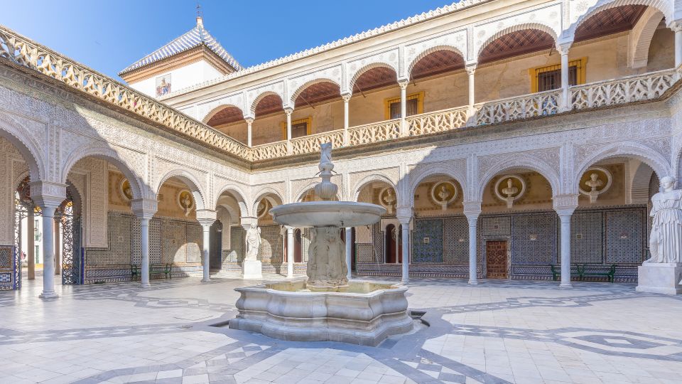 Seville: Casa de Pilatos Ground Floor Entry Ticket - Entering through the Renaissance marble gate and courtyard flow
