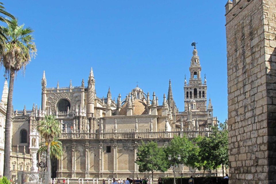 Seville: Cathedral, Giralda & Alcázar Guided Tour - Real Alcázar: gardens plus the shock of a still-used palace