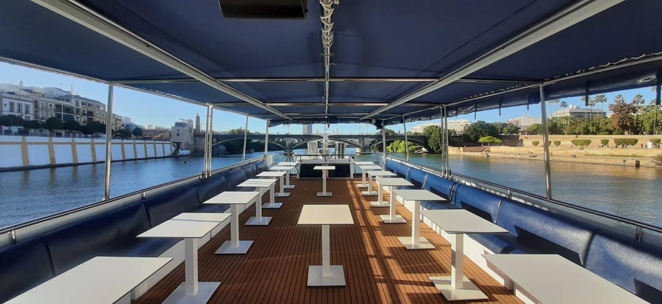 Seville: Guadalquivir Boat Tour with Optional Lunch/Dinner - Onboard Comfort: Sun Terrace, Decks, and Bar Service