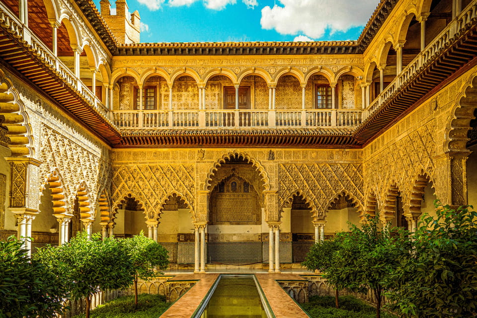Seville: Priority Access Cathedral, Giralda & Alcázar Tour - Giralda Tower climb: gradual, historic, and worth the stairs