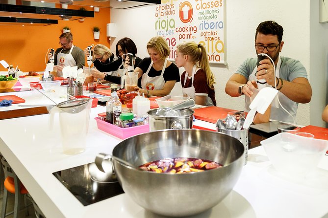Spanish Cooking Class Paella Tapas and Sangria in Madrid - Meal time: sangria, pacing, and taking food home